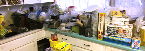 Cluttered kitchen area image one